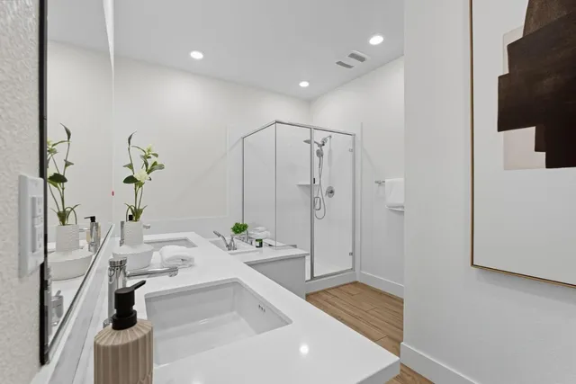 a bathroom with a bathtub and a shower