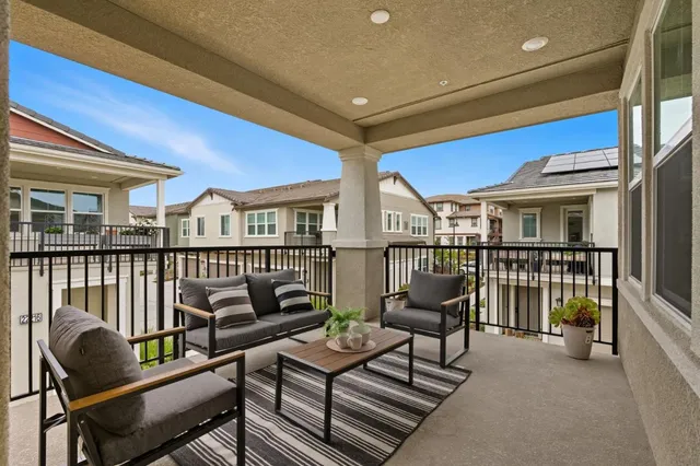 a view of a balcony with chairs