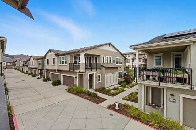 a view of a white building with many windows