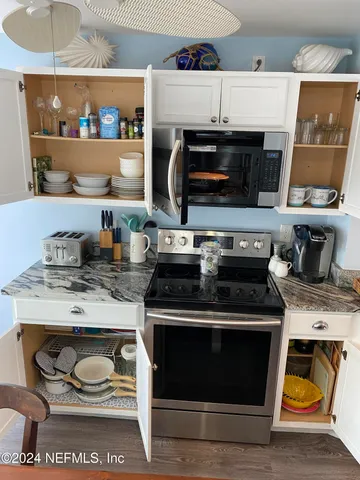 a kitchen with a stove and a microwave