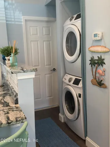 a utility room with sink dryer and washer