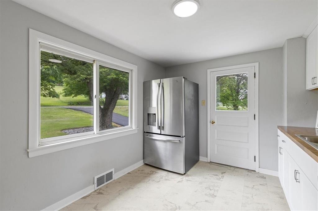 301 McCombs Road Venetia, PA 15367 - Photo 11 of 37 a view of a kitchen with a refrigerator cabinets and a window