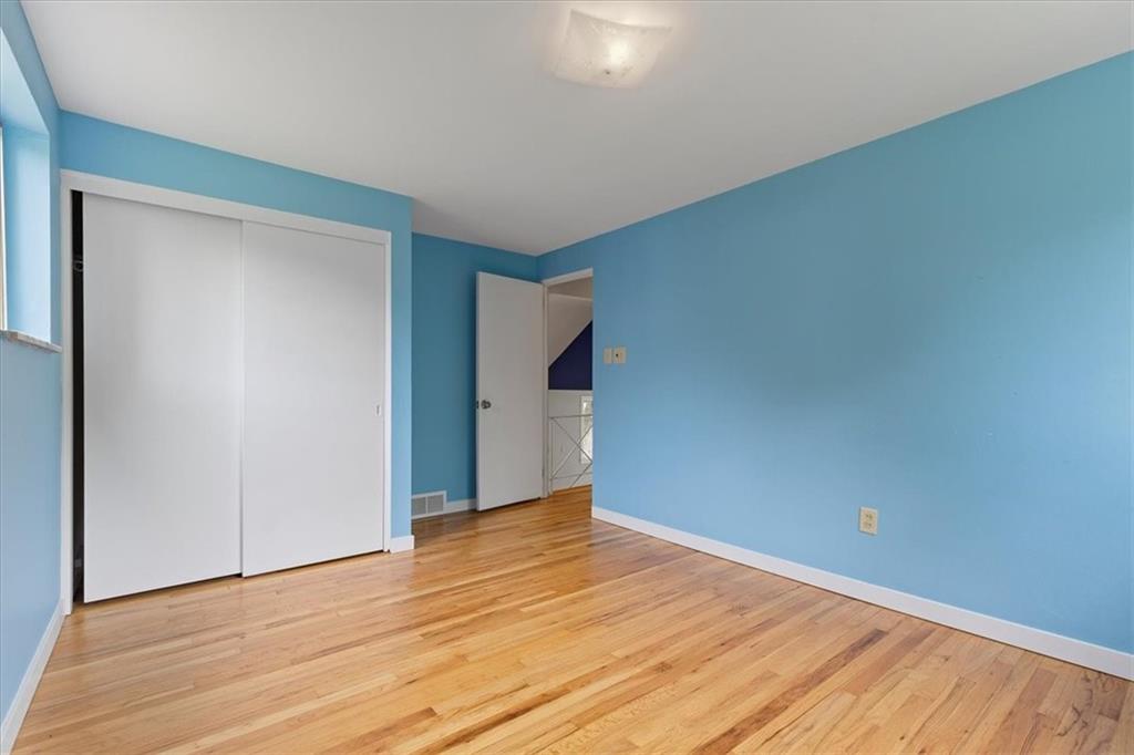 301 McCombs Road Venetia, PA 15367 - Photo 16 of 37 a view of an empty room with wooden floor and a window