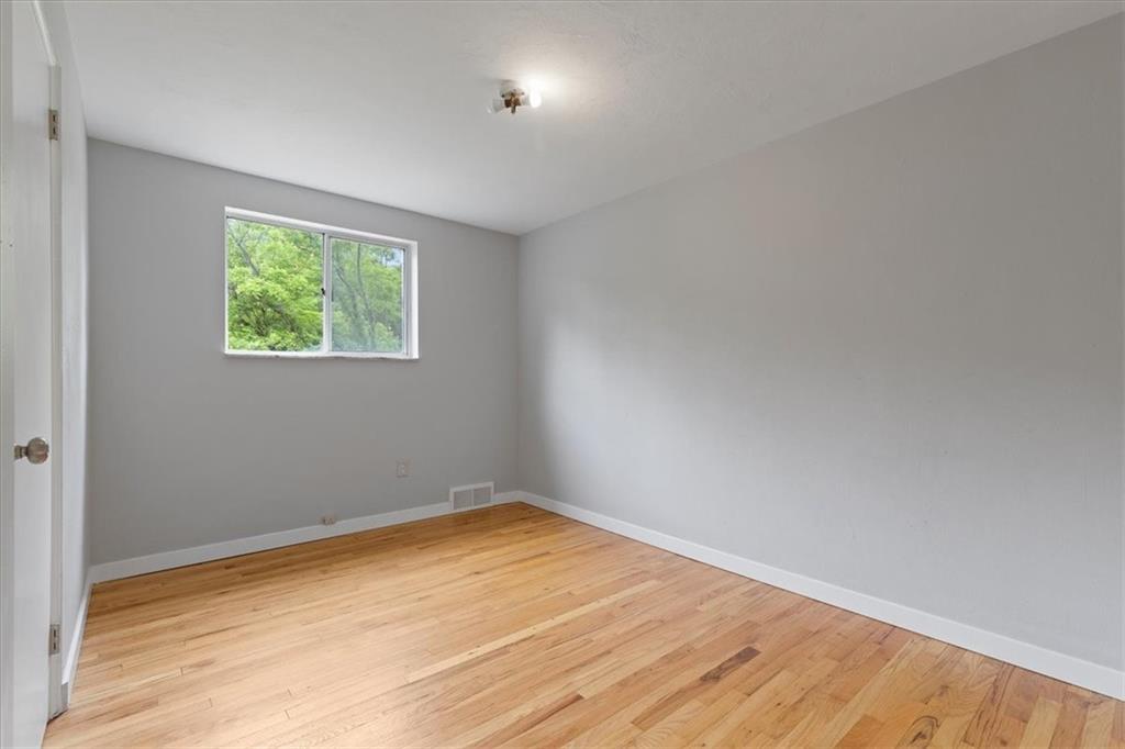 301 McCombs Road Venetia, PA 15367 - Photo 17 of 37 an empty room with wooden floor and windows