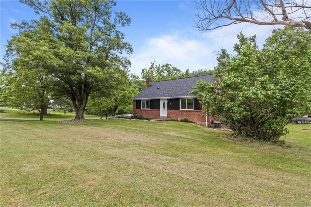 301 McCombs Road Venetia, PA 15367 - Photo 2 of 37 a front view of a house with a garden