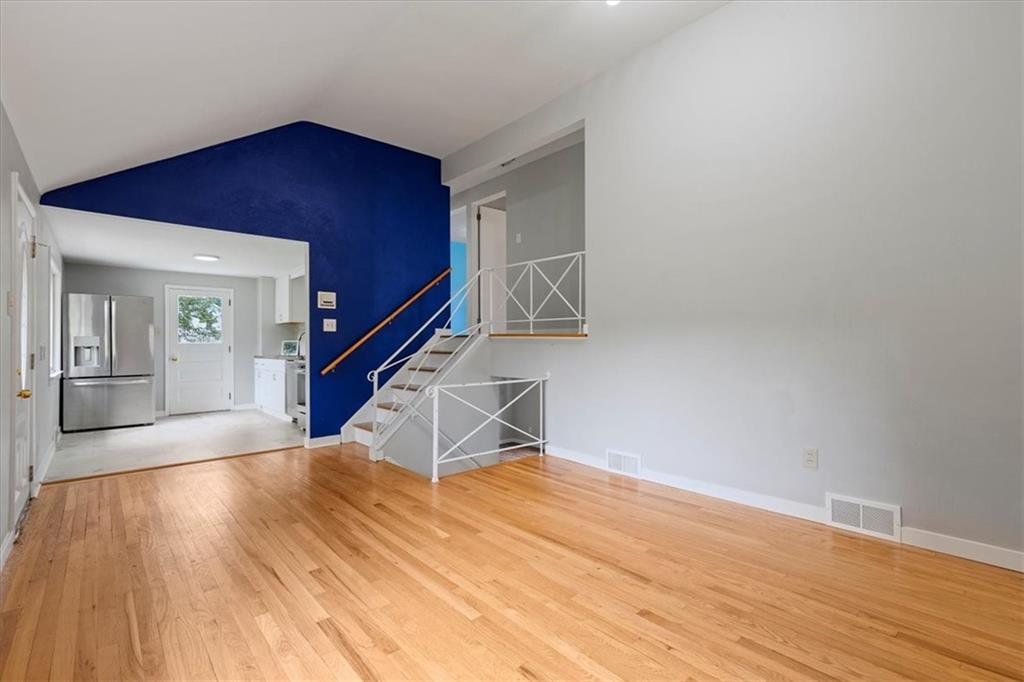 301 McCombs Road Venetia, PA 15367 - Photo 8 of 37 a view of an empty room with wooden floor and a window