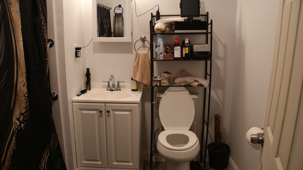 1951 Pleasant Street Fall River, MA 02723 - Photo 13 of 24 a bathroom with a sink and toilet