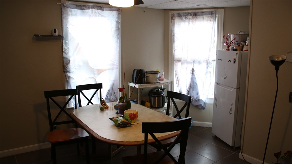 1951 Pleasant Street Fall River, MA 02723 - Photo 16 of 24 a view of a dining room with furniture window and wooden floor