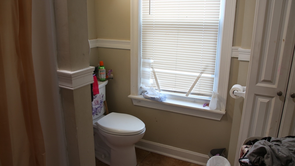 1951 Pleasant Street Fall River, MA 02723 - Photo 20 of 24 a bathroom with a toilet and a window