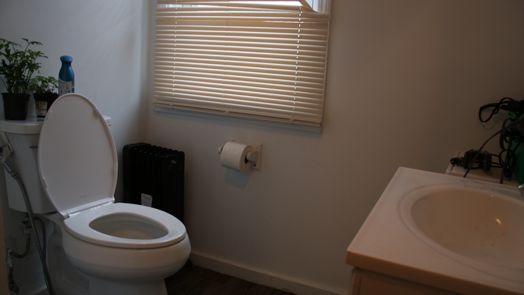 1951 Pleasant Street Fall River, MA 02723 - Photo 8 of 24 a bathroom with a sink and a toilet