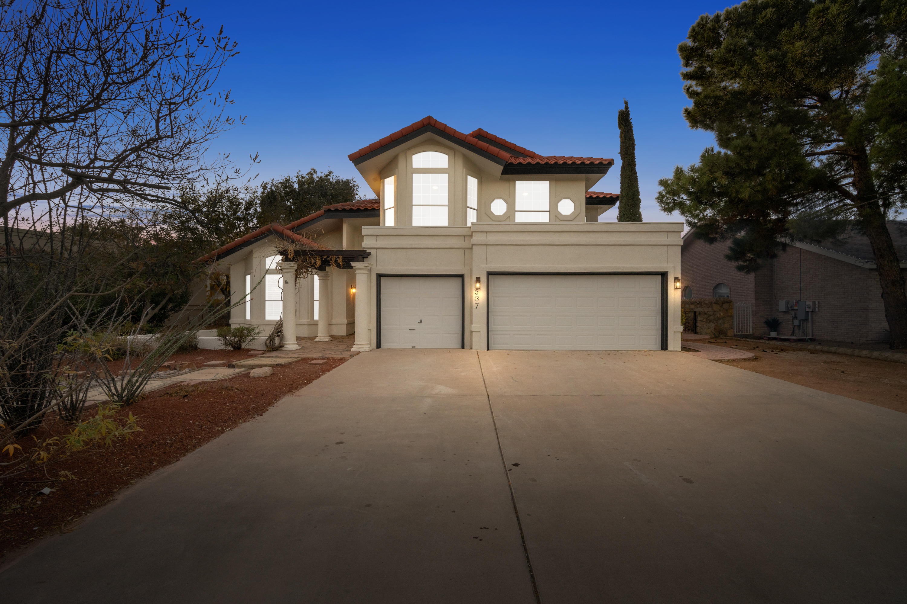 537 Rosinante Road El Paso, TX 79922 - Photo 1 of 1 a front view of a house with a yard and garage