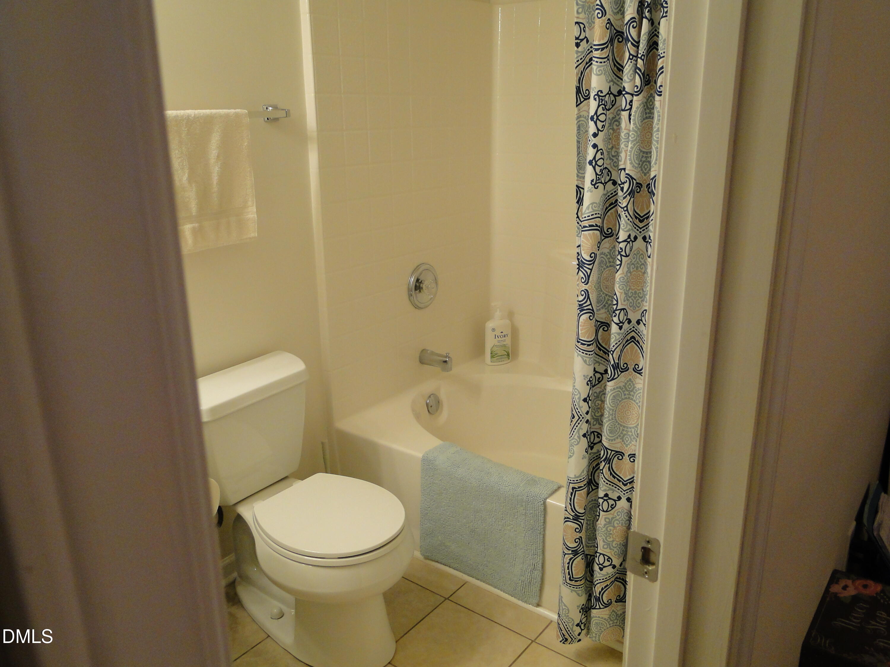 5304 Marthonna Way Raleigh, NC 27616 - Photo 12 of 19 a bathroom with a toilet and shower