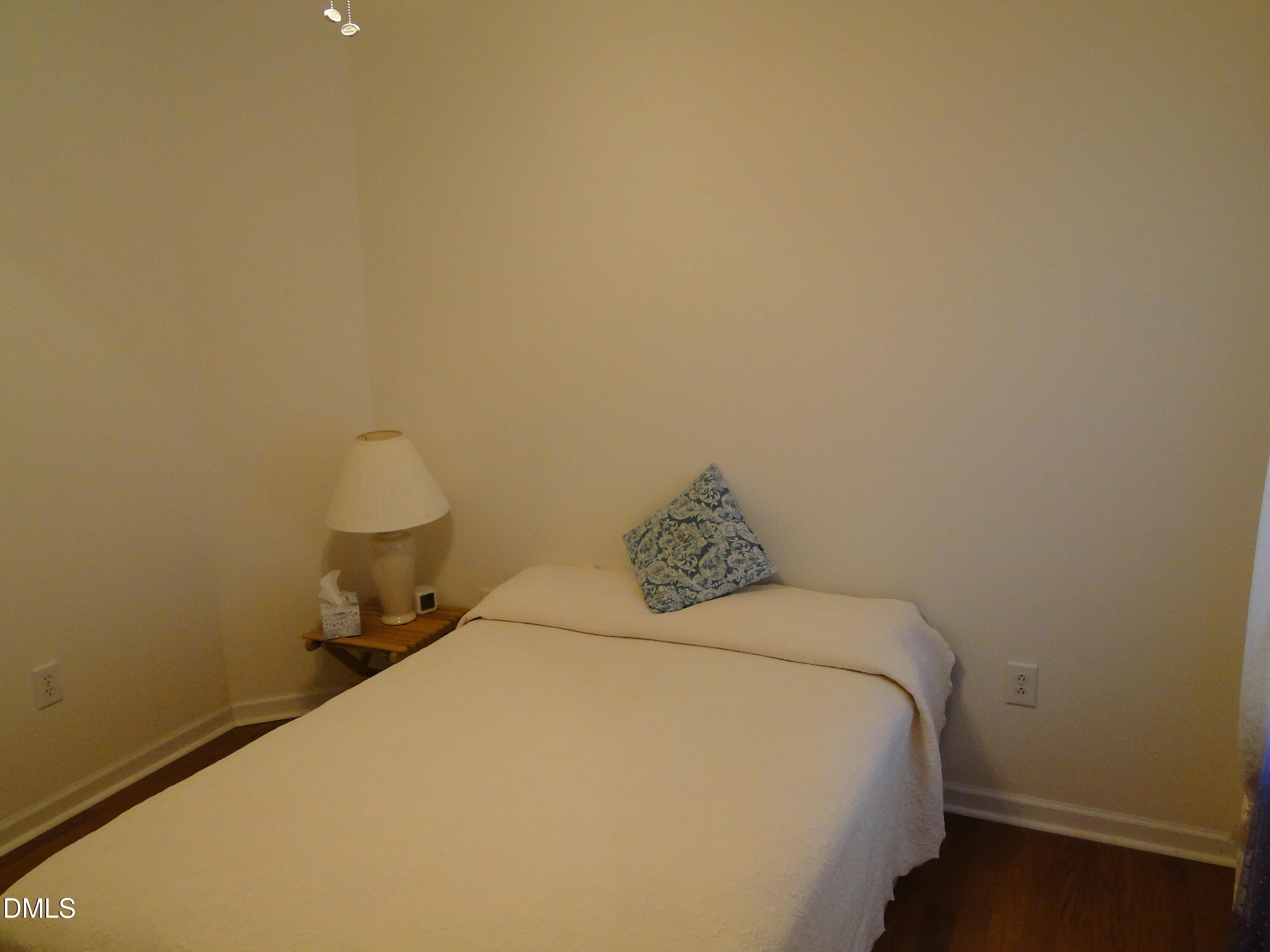 5304 Marthonna Way Raleigh, NC 27616 - Photo 18 of 19 a bedroom with a bed and a wall painting