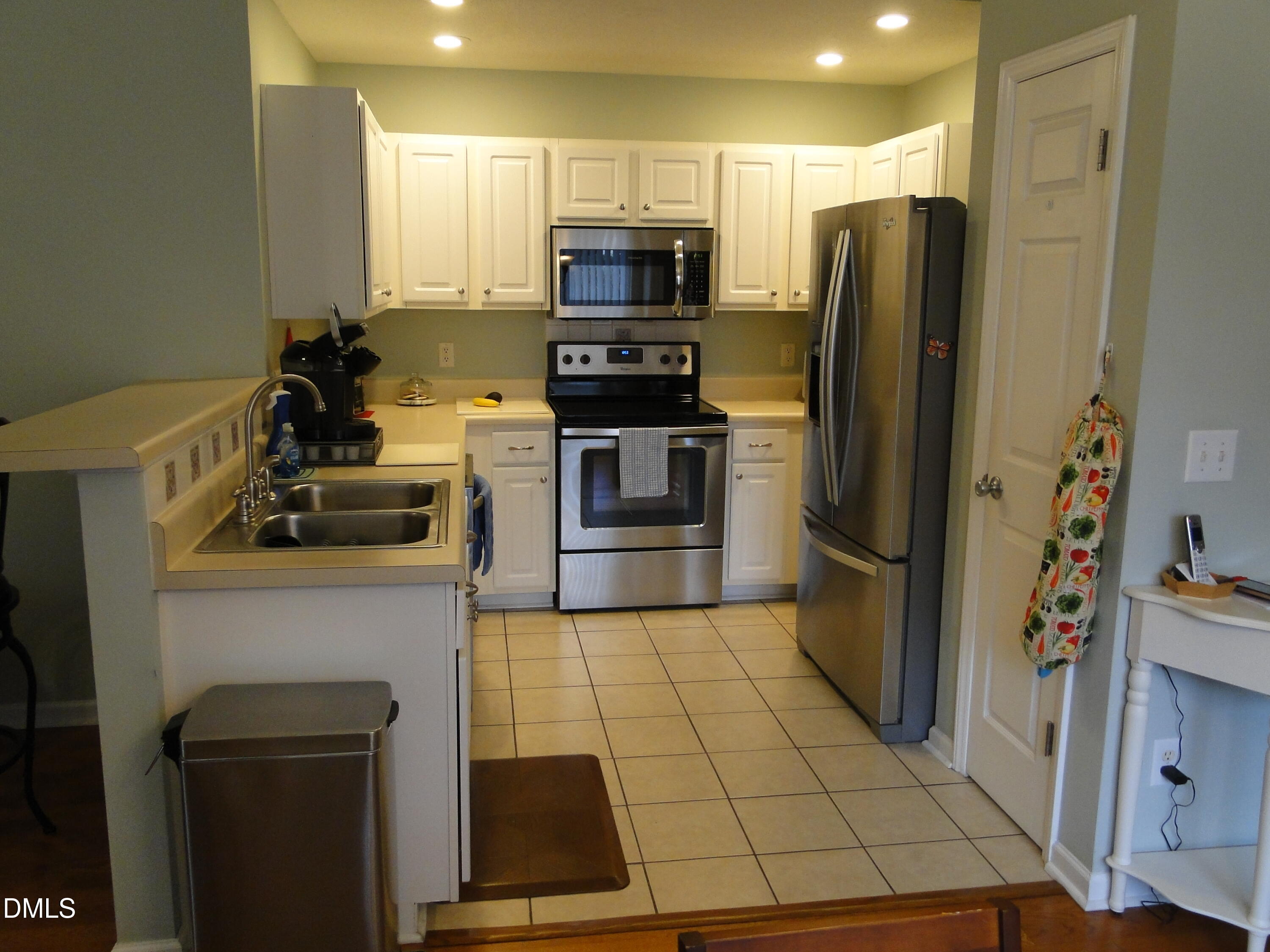 5304 Marthonna Way Raleigh, NC 27616 - Photo 5 of 19 a kitchen with stainless steel appliances a refrigerator and a stove top oven