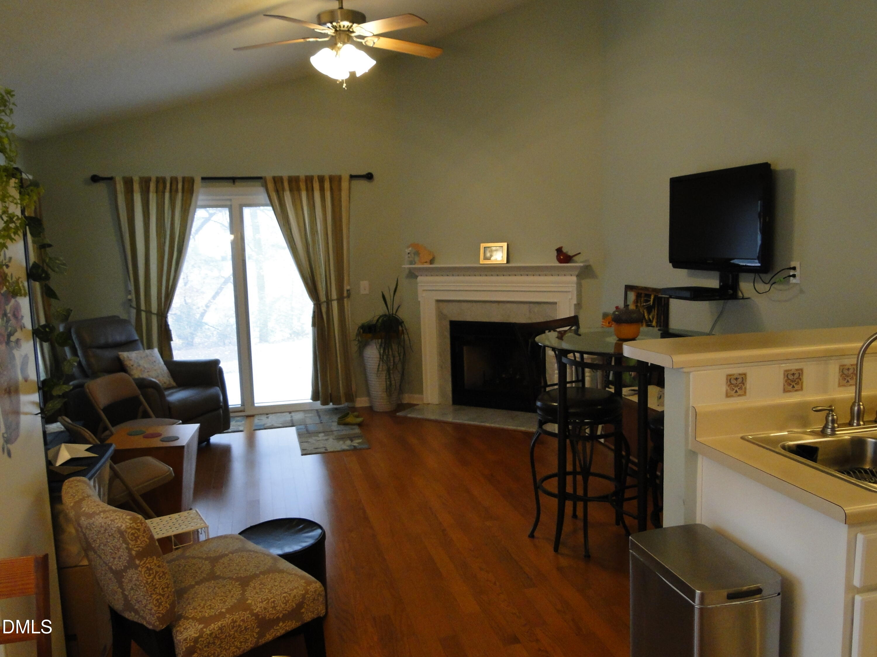 5304 Marthonna Way Raleigh, NC 27616 - Photo 6 of 19 a living room with furniture and a flat screen tv