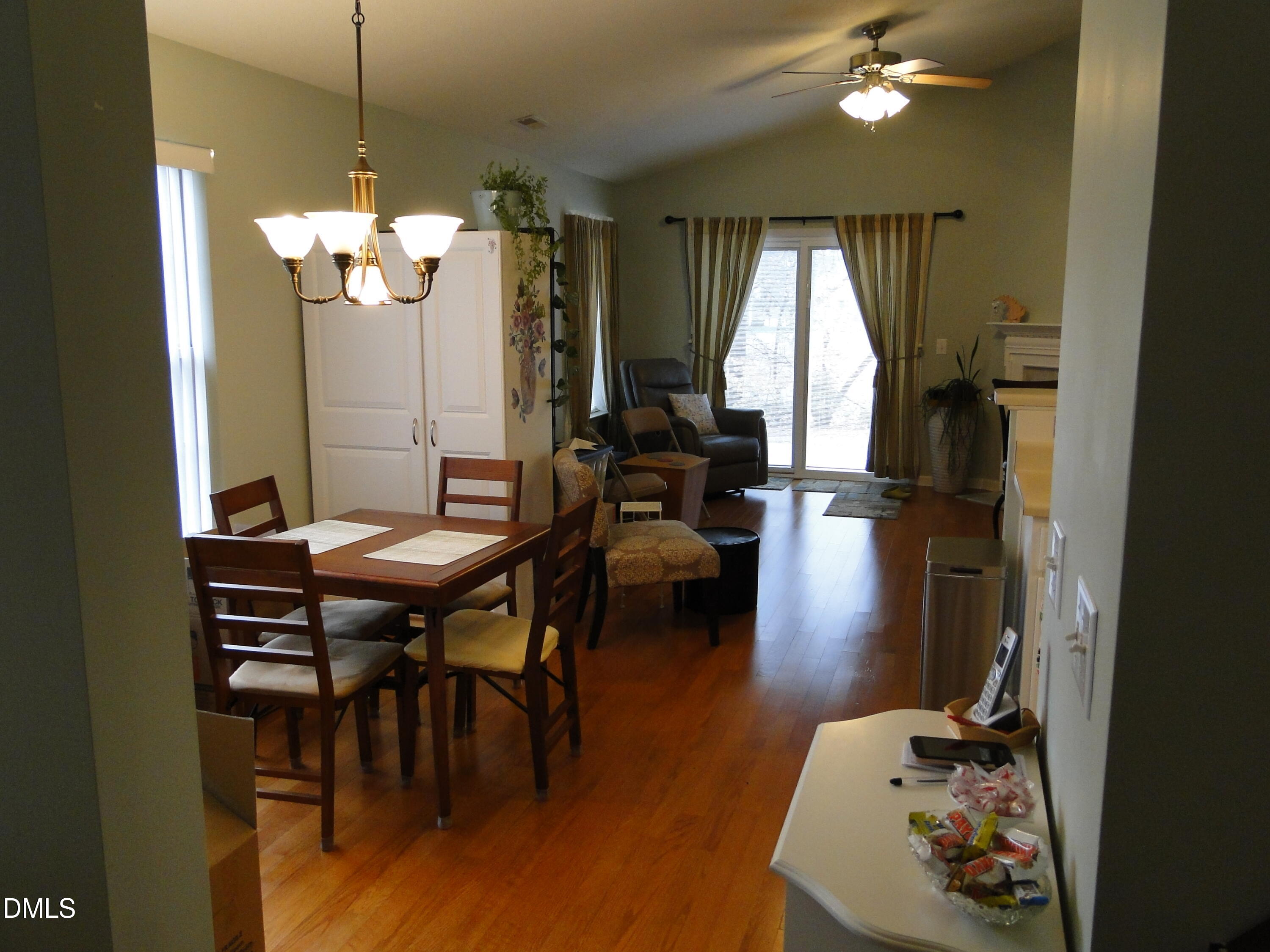5304 Marthonna Way Raleigh, NC 27616 - Photo 7 of 19 a view of a dining room with furniture window and wooden floor