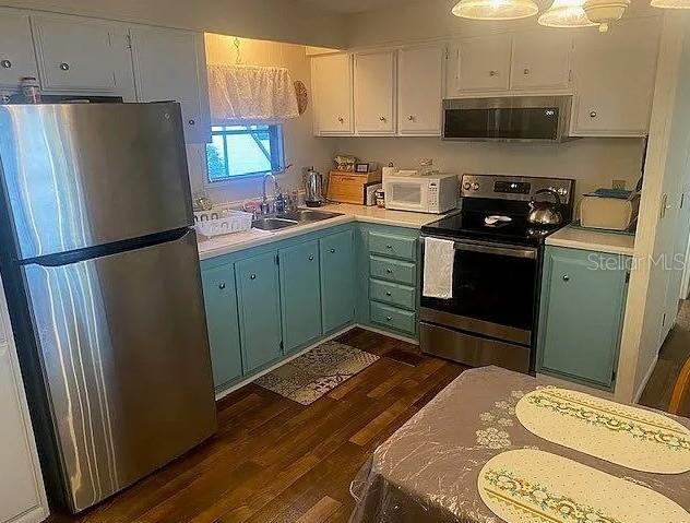 25225 Northeast 139th Street Salt Springs, FL 32134 - Photo 7 of 14 a kitchen with a refrigerator and a stove