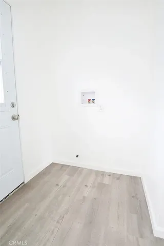 a kitchen with a sink stove and refrigerator
