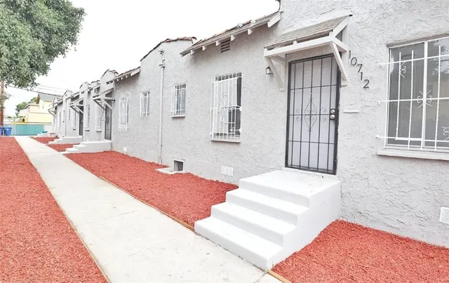 a view of a street with a building in the background