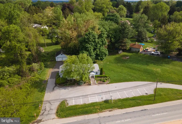 a view of a garden with houses