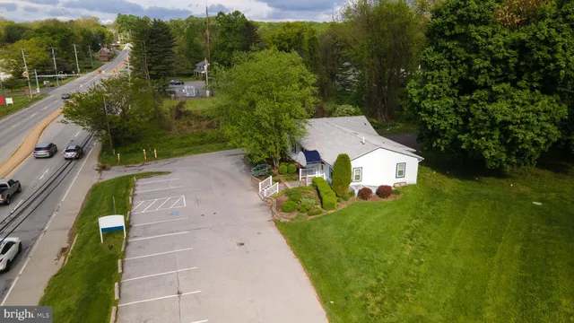 a aerial view of a house with a yard