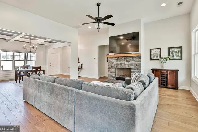 a living room with furniture fireplace and a flat screen tv