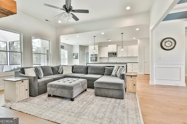 a living room with furniture and a table