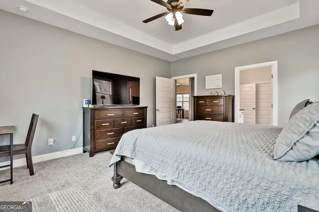 a bedroom with a bed and furniture