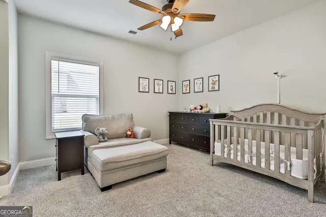 a bedroom with furniture and a window
