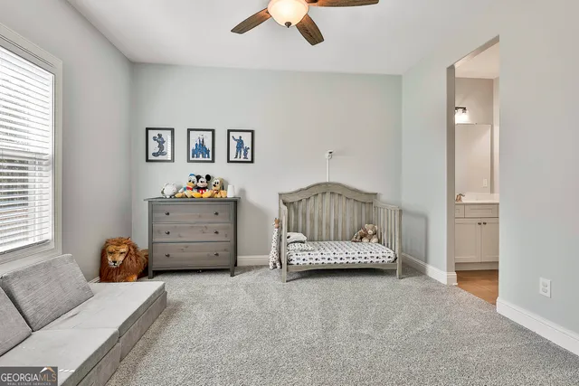 a bedroom with a bed and a couch