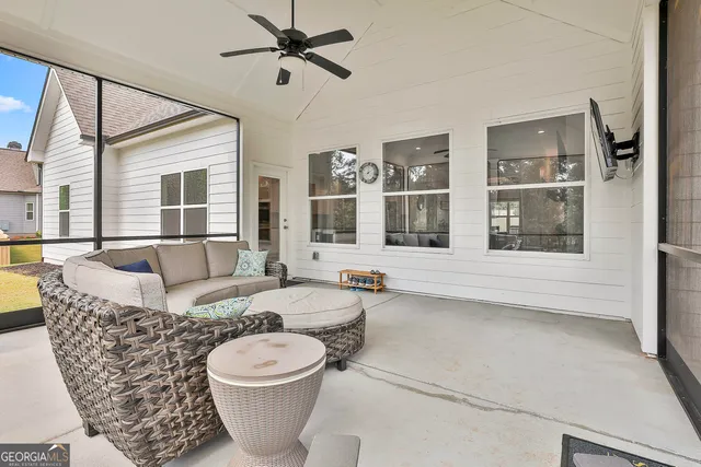 a living room with furniture and a window