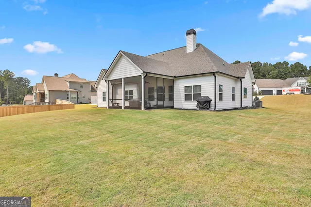 a view of a house with an outdoor space and seating area