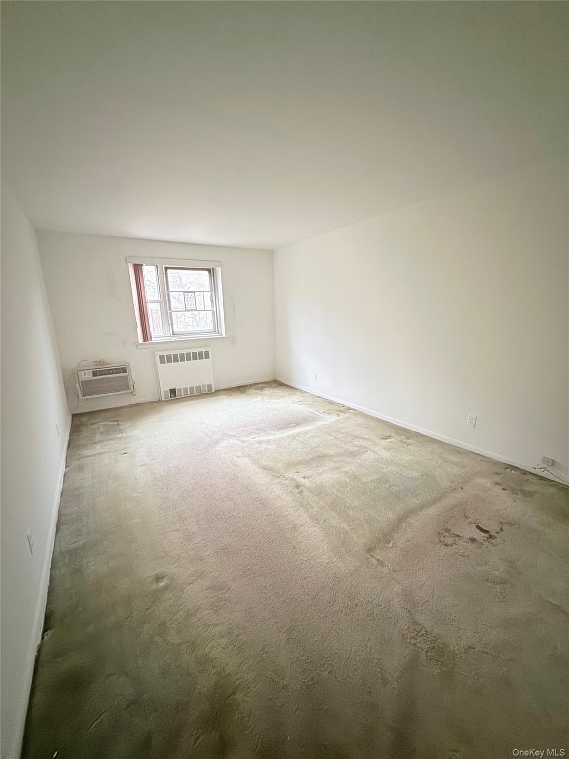 88-08 151st Avenue, Unit 3H Queens, NY 11414 - Photo 12 of 13 an empty room with windows