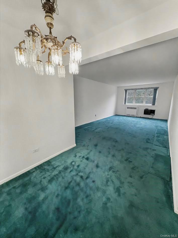 88-08 151st Avenue, Unit 3H Queens, NY 11414 - Photo 2 of 13 a view of a chandelier in big room