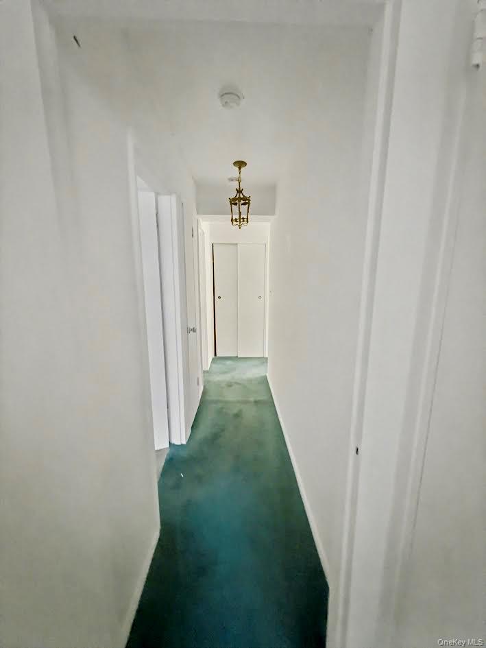 88-08 151st Avenue, Unit 3H Queens, NY 11414 - Photo 8 of 13 a view of a hallway with a hallway