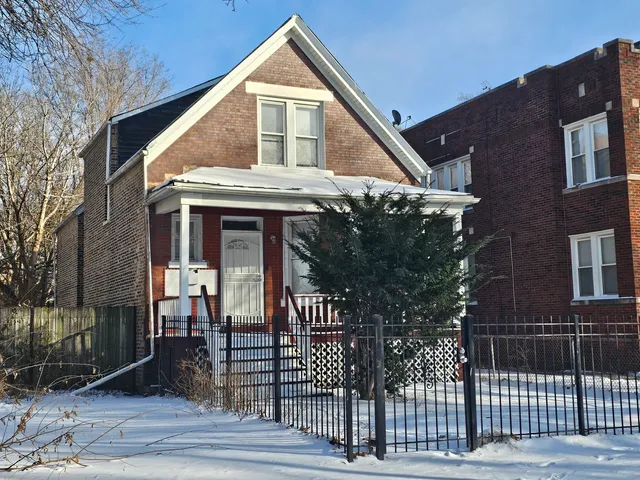 a view of a brick house with a large window