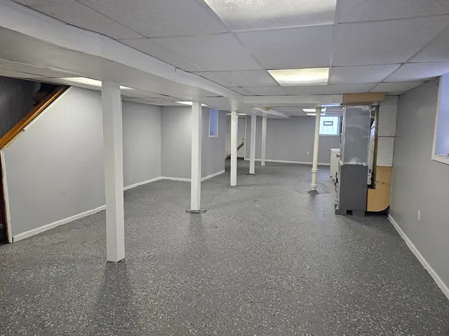 a view of a house with wooden deck