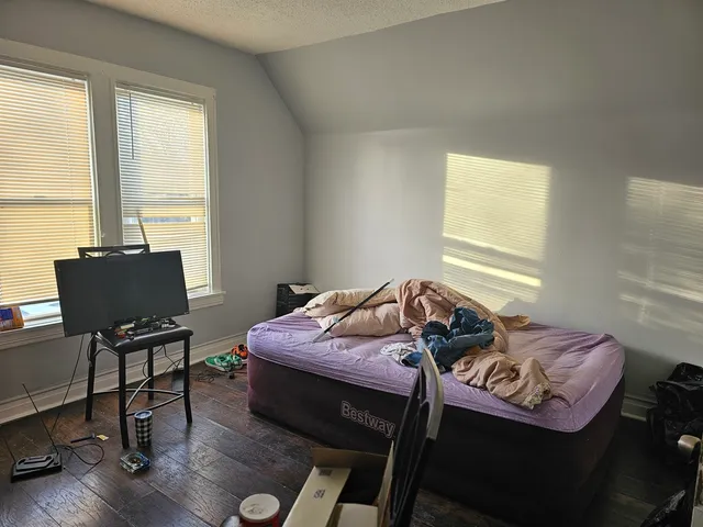 a bed room with furniture and a window