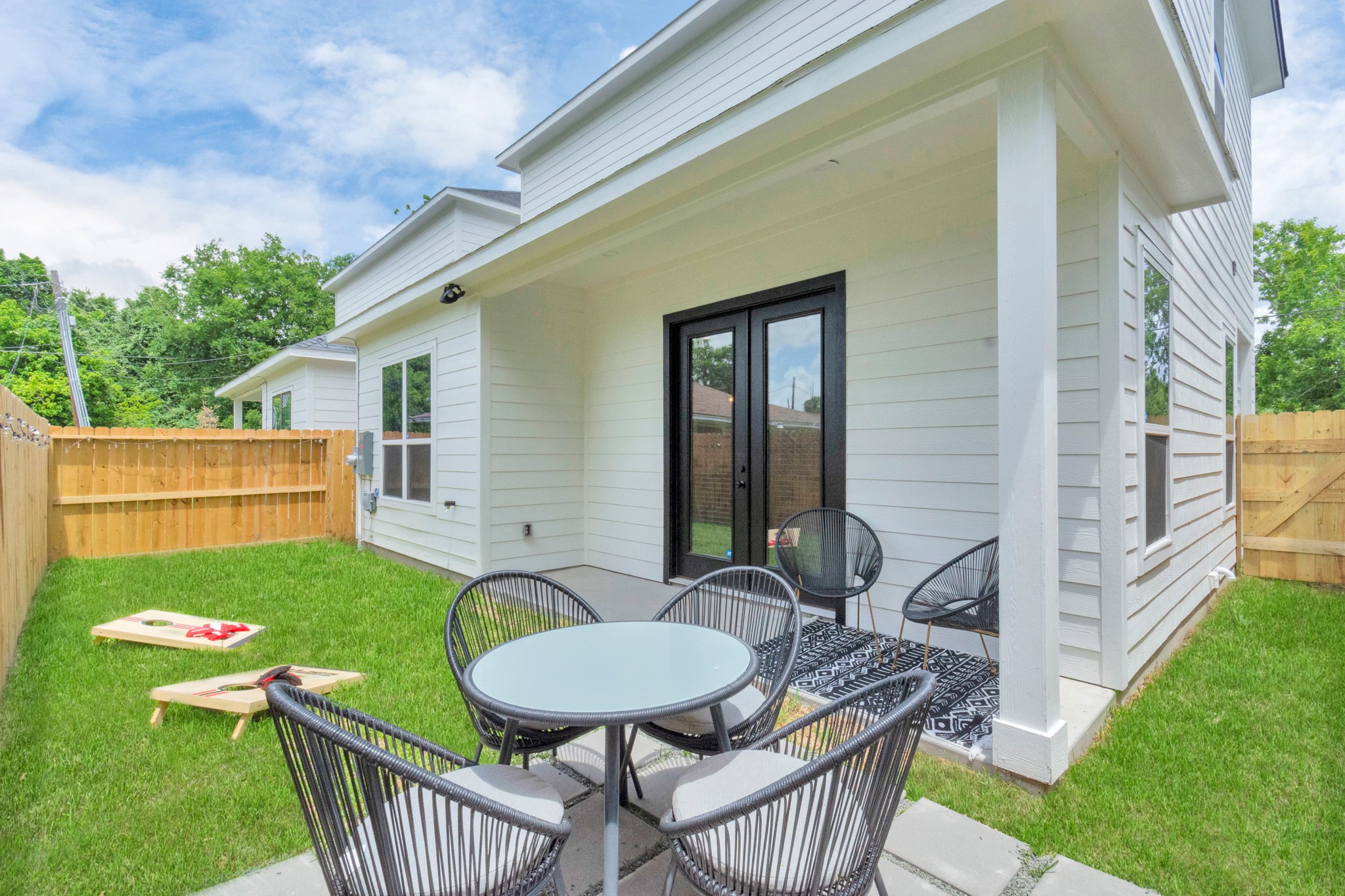 5308 Denmark Street Houston, TX 77028 - Photo 35 of 36 a view of a patio with table and chairs with wooden fence