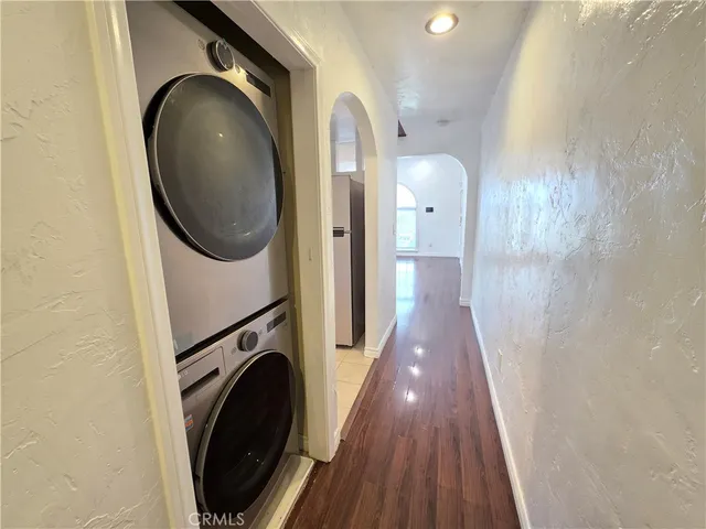 a view of a hallway with washer and dryer