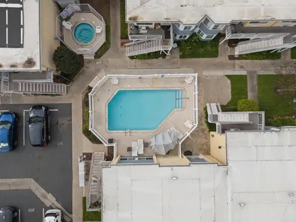 a view of cars parked in front of a house