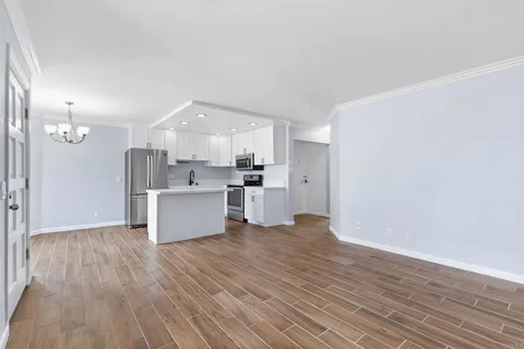 a view of kitchen with wooden floor