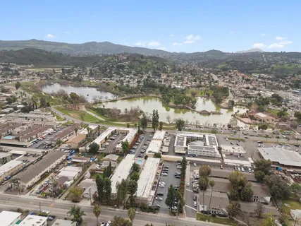 an aerial view of a city with lake view
