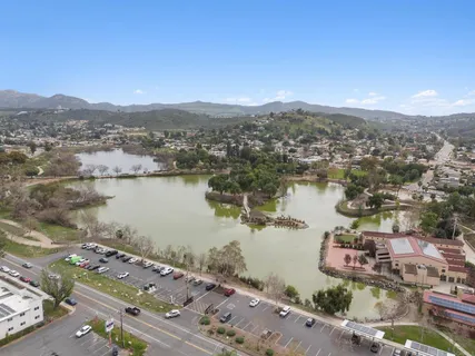 a large building with a mountain in the background