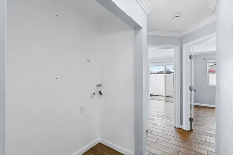 a view of room with wooden floor