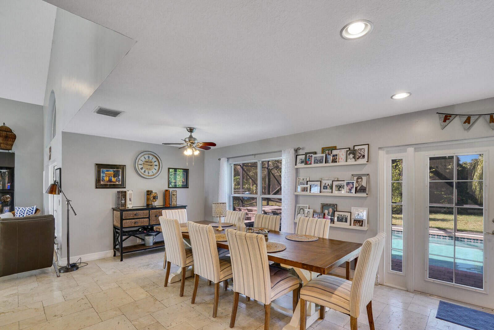 8599 Cypress Springs Road Lake Worth, FL 33467 - Photo 14 of 59 a view of a dining room with furniture