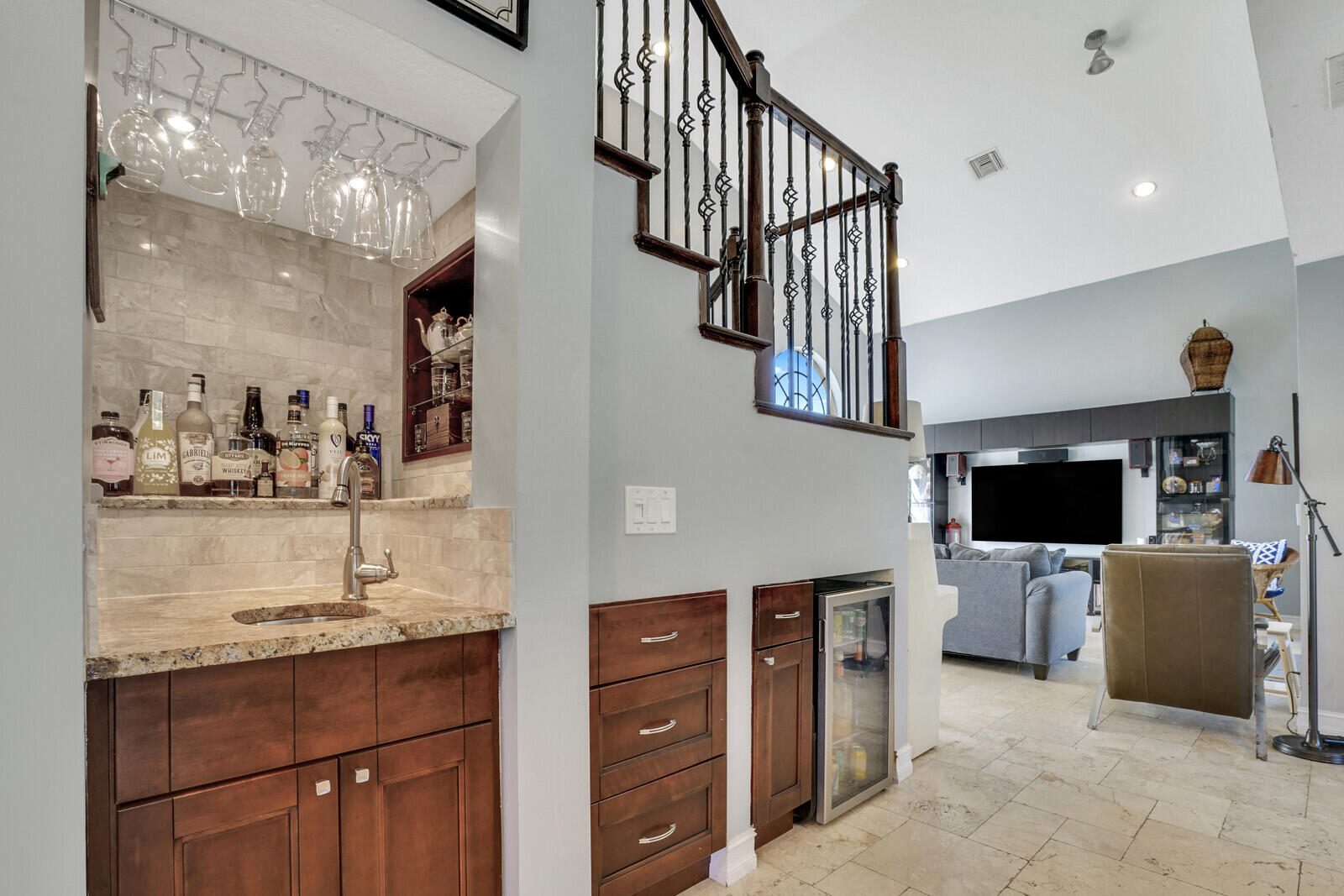 8599 Cypress Springs Road Lake Worth, FL 33467 - Photo 16 of 59 a kitchen with stainless steel appliances kitchen island granite countertop a refrigerator and a stove top oven