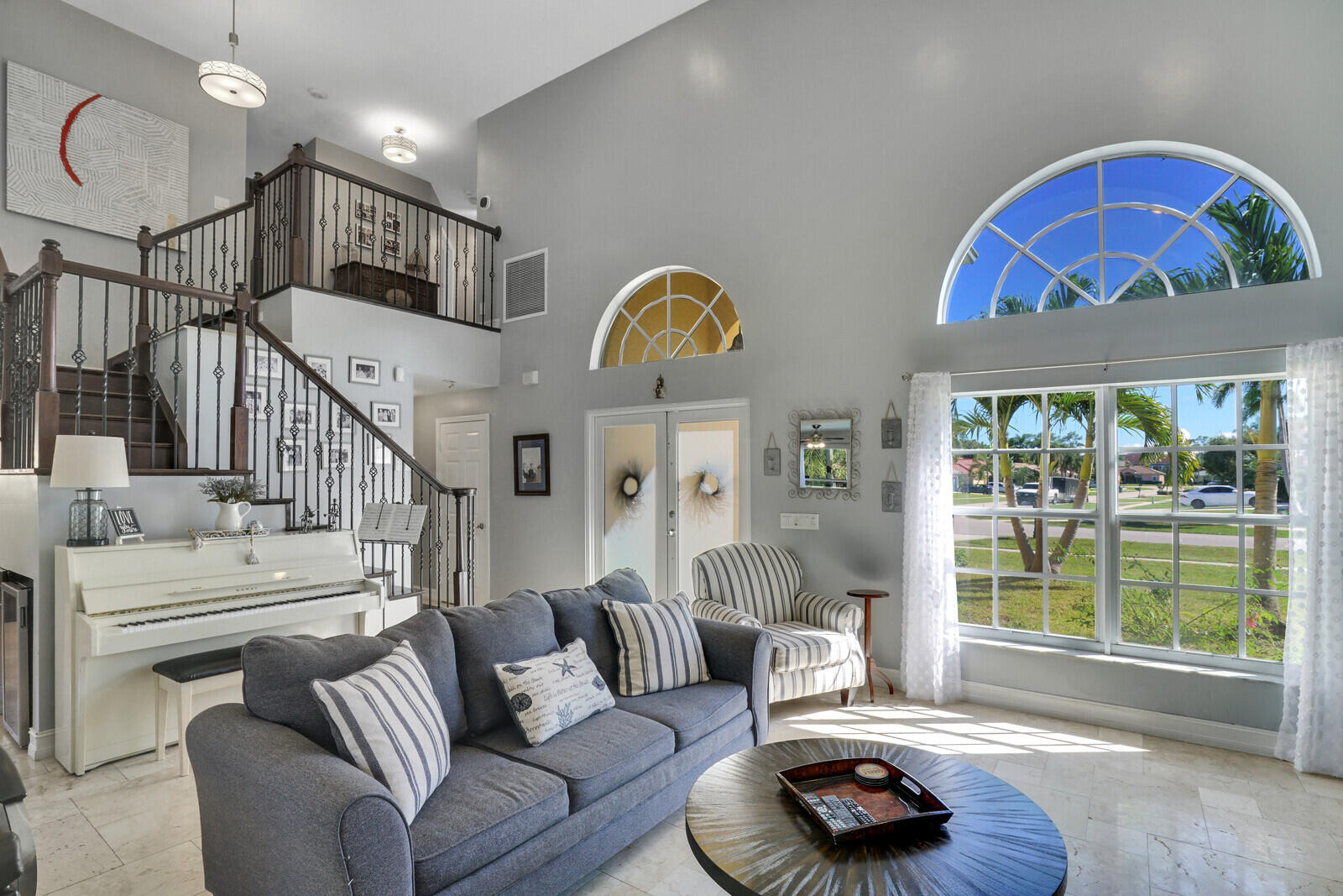 8599 Cypress Springs Road Lake Worth, FL 33467 - Photo 10 of 59 a living room with furniture and a floor to ceiling window