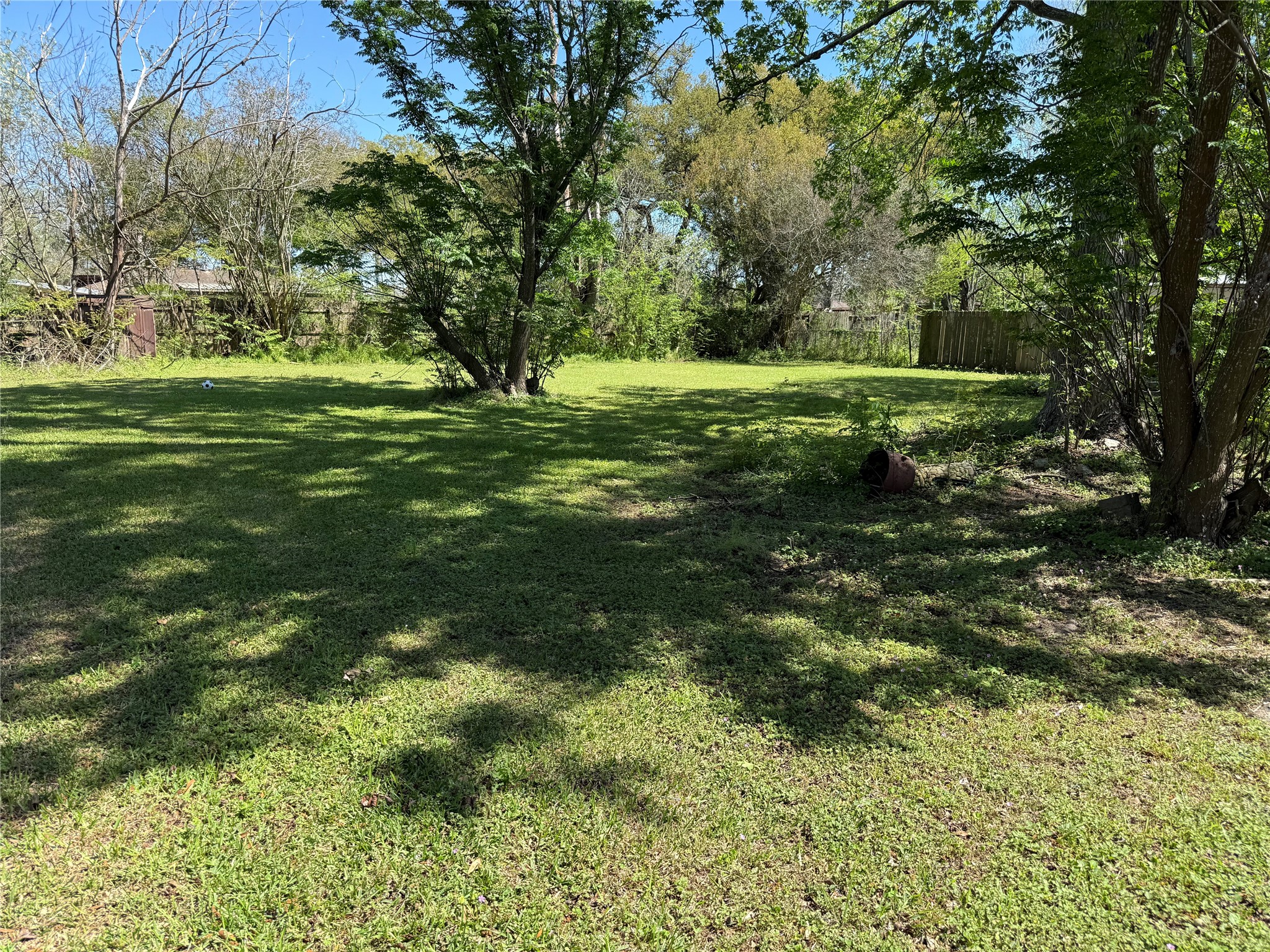 2607 Lilac Street Pasadena, TX 77503 - Photo 12 of 12 a view of a green field with trees