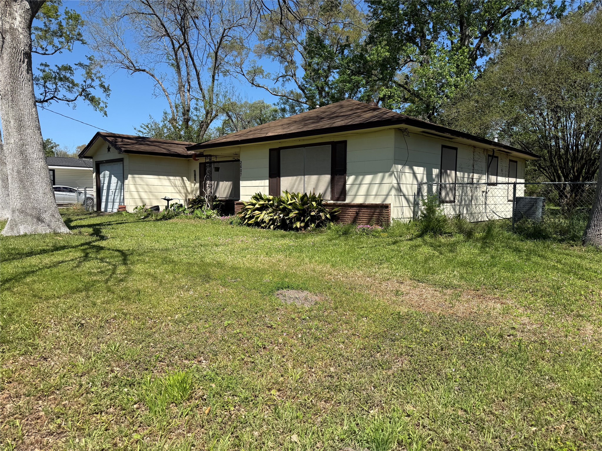 2607 Lilac Street Pasadena, TX 77503 - Photo 2 of 12 a view of a house with yard and sitting area